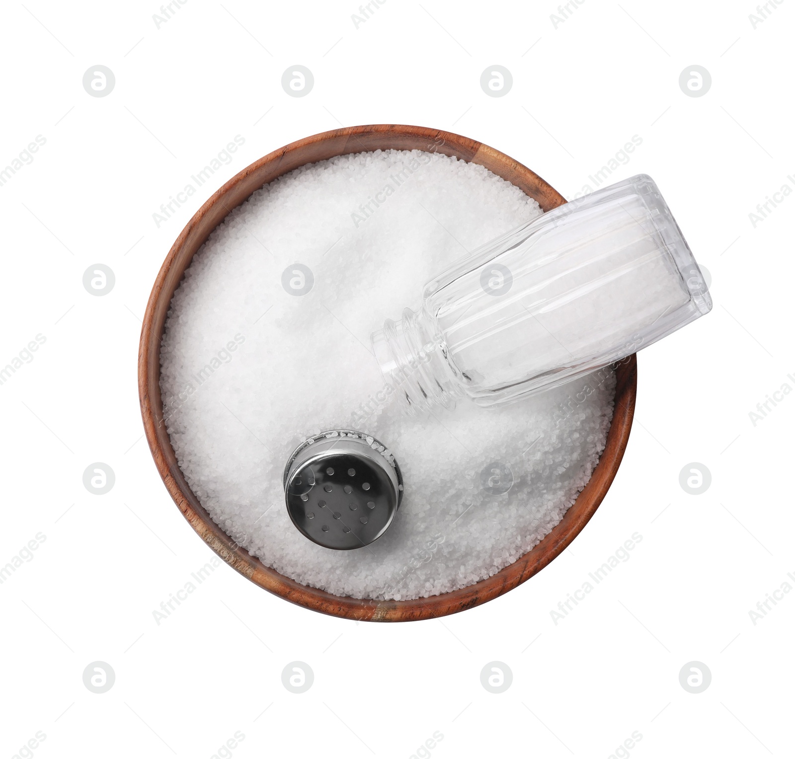 Photo of Natural salt and shaker in bowl on white background, top view. Space for text