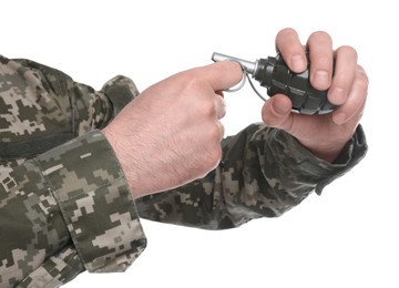 Photo of Soldier pulling safety pin out of hand grenade on white background, closeup. Military service