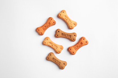 Bone shaped dog cookies on white background, top view