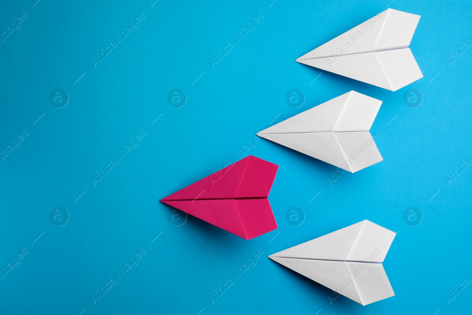 Photo of Flat lay composition with paper planes on light blue background, space for text
