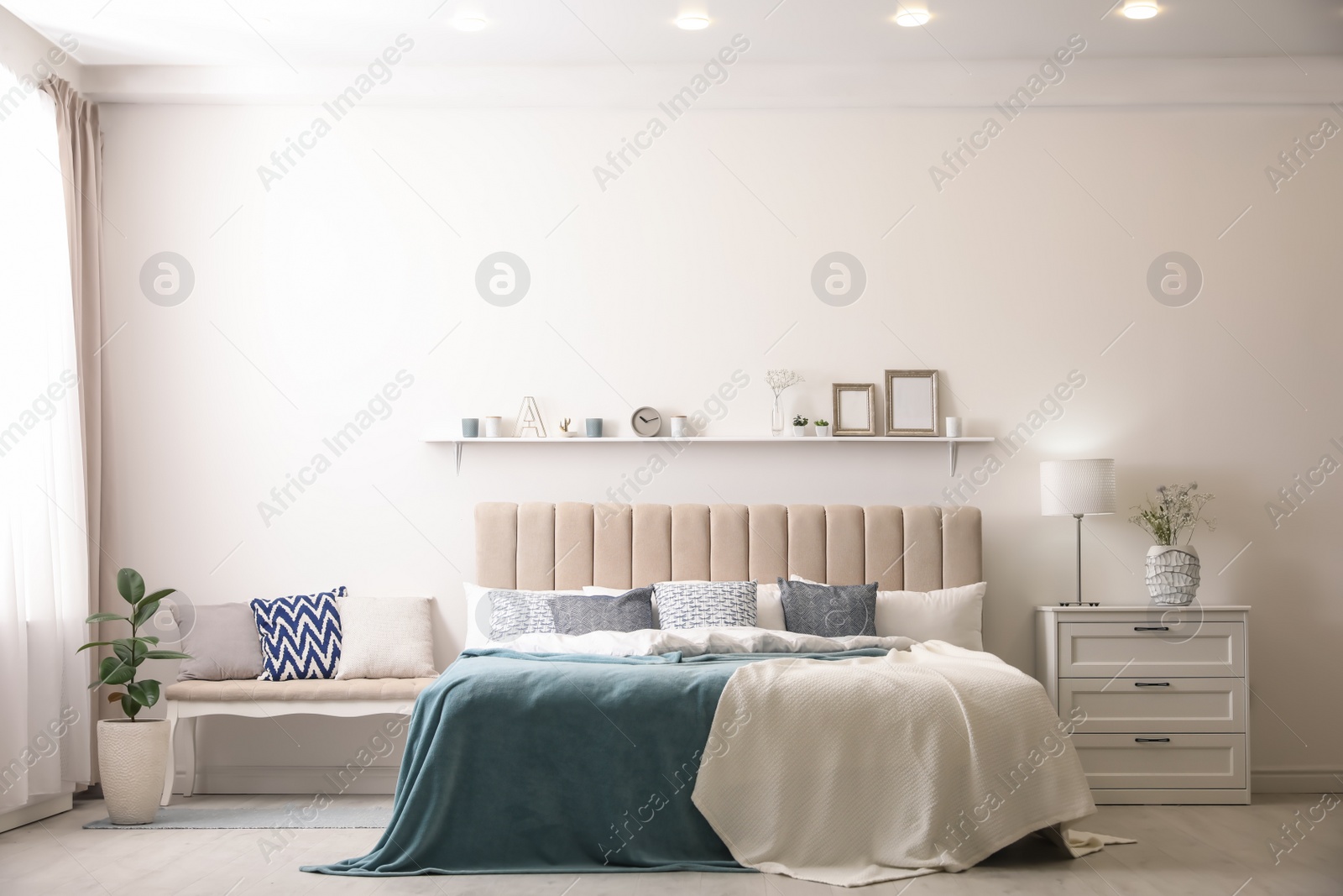 Photo of Comfortable bed with pillows in room. Stylish interior design