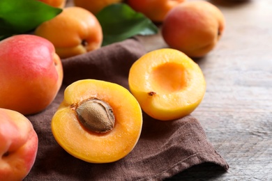 Delicious fresh ripe apricots on wooden table