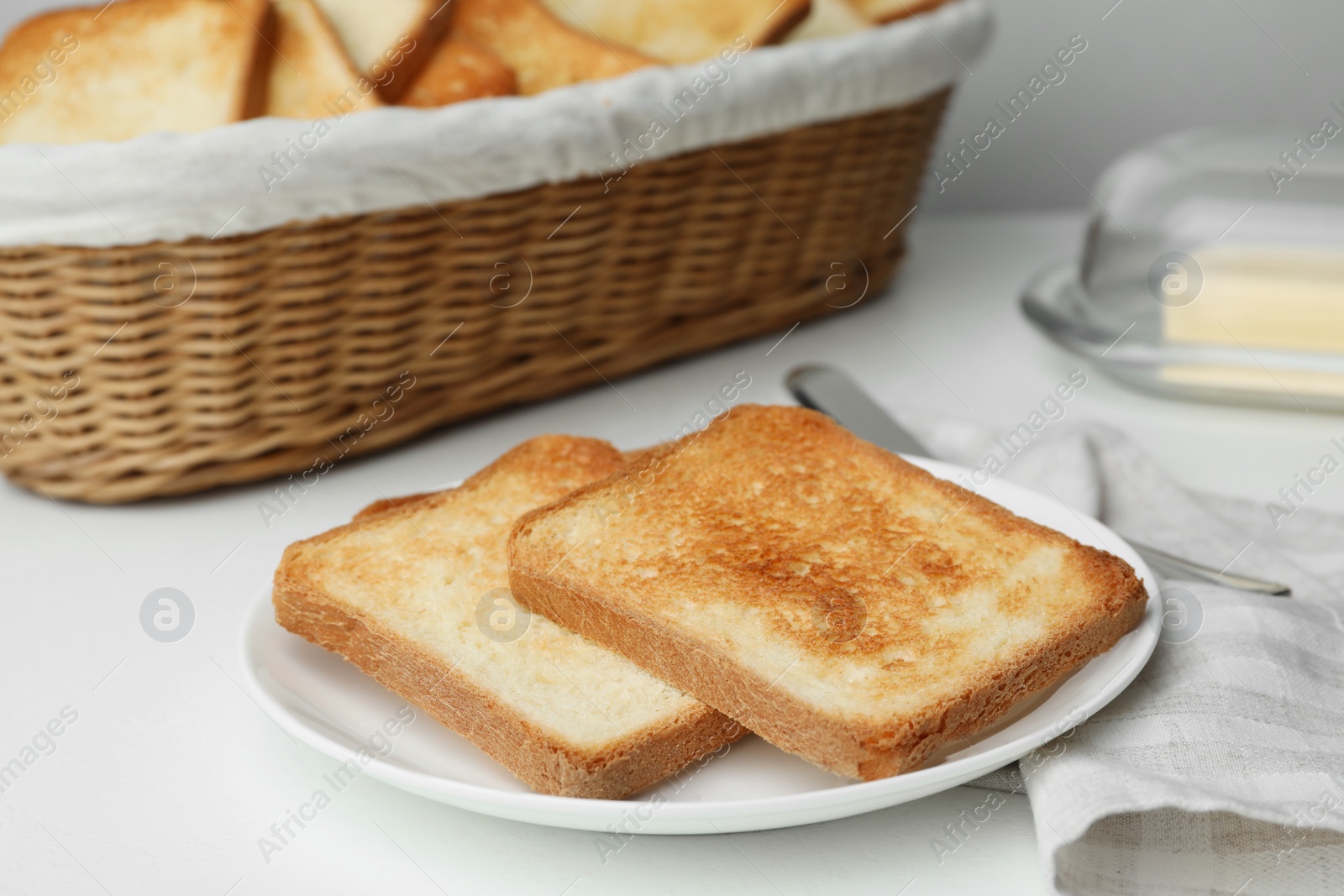 Photo of Slices of toasted bread on white table