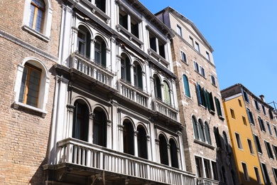 Photo of View of beautiful old buildings with windows