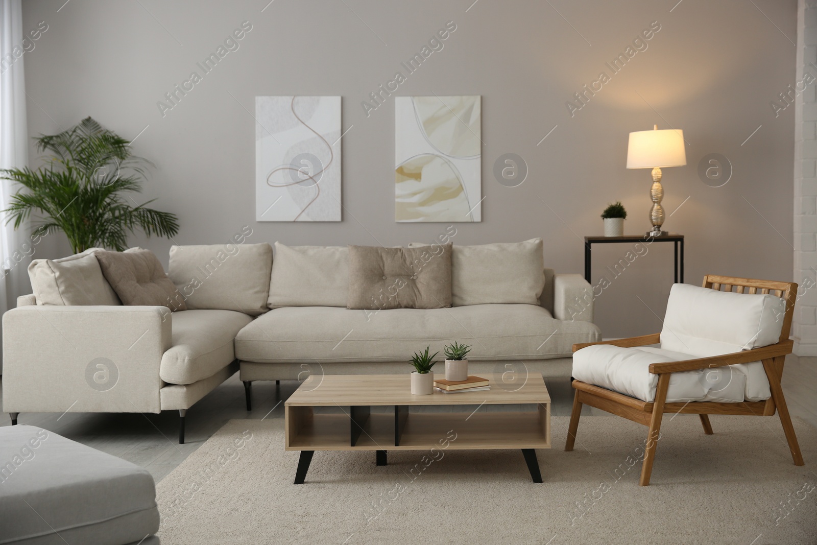 Photo of Big comfortable sofa in living room. Interior design