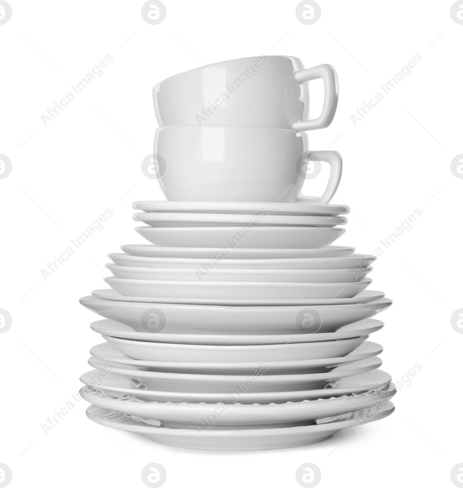 Photo of Stack of clean tableware isolated on white