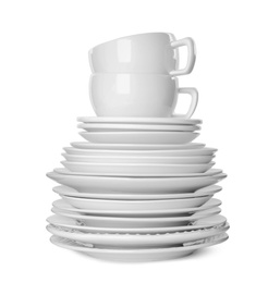 Photo of Stack of clean tableware isolated on white