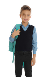 Photo of Little boy in school uniform with backpack on white background