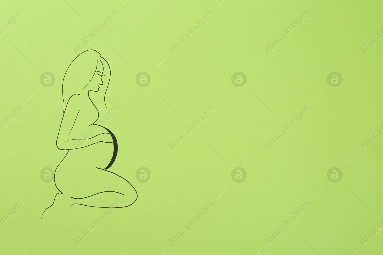 Photo of Pregnant woman figure drawn on light green background, top view with space for text. Surrogacy concept