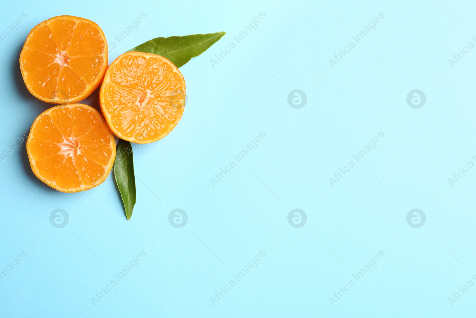 Photo of Composition with tangerines and leaves on color background, flat lay. Space for text