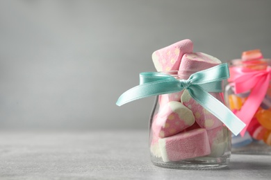 Tasty sweets on light grey table, closeup. Space for text