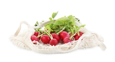 String bag with radishes isolated on white