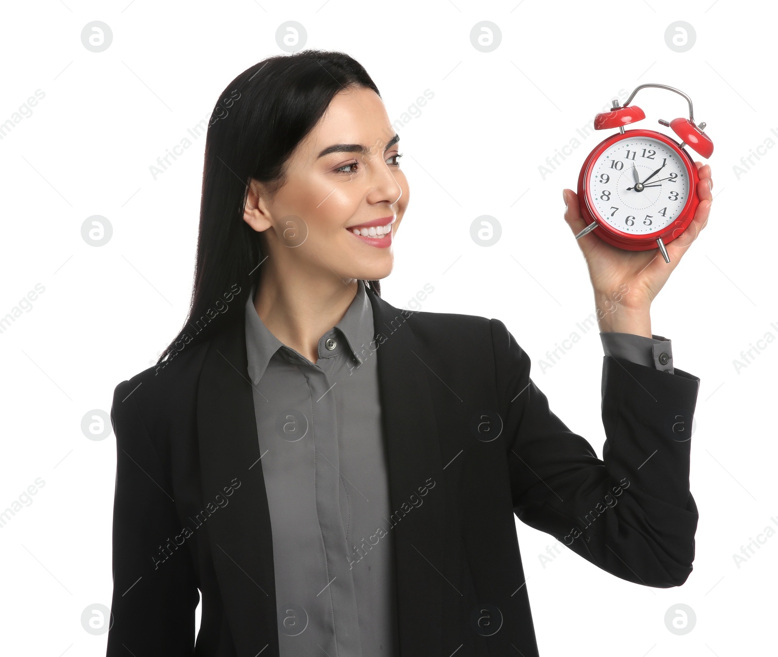 Photo of Businesswoman holding alarm clock on white background. Time management