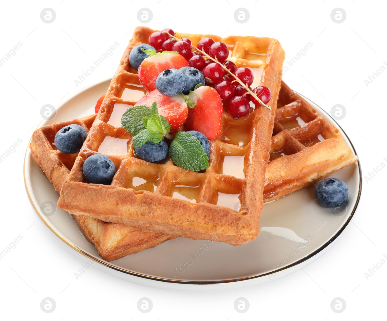 Photo of Delicious Belgian waffles with berries on white background