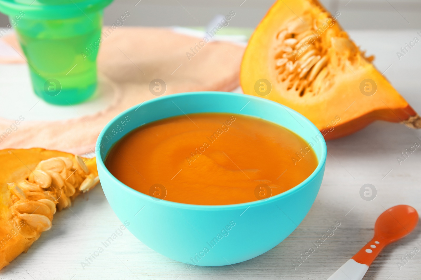 Photo of Bowl of healthy baby food on light table