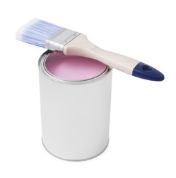Photo of Can with pink paint and brush on white background