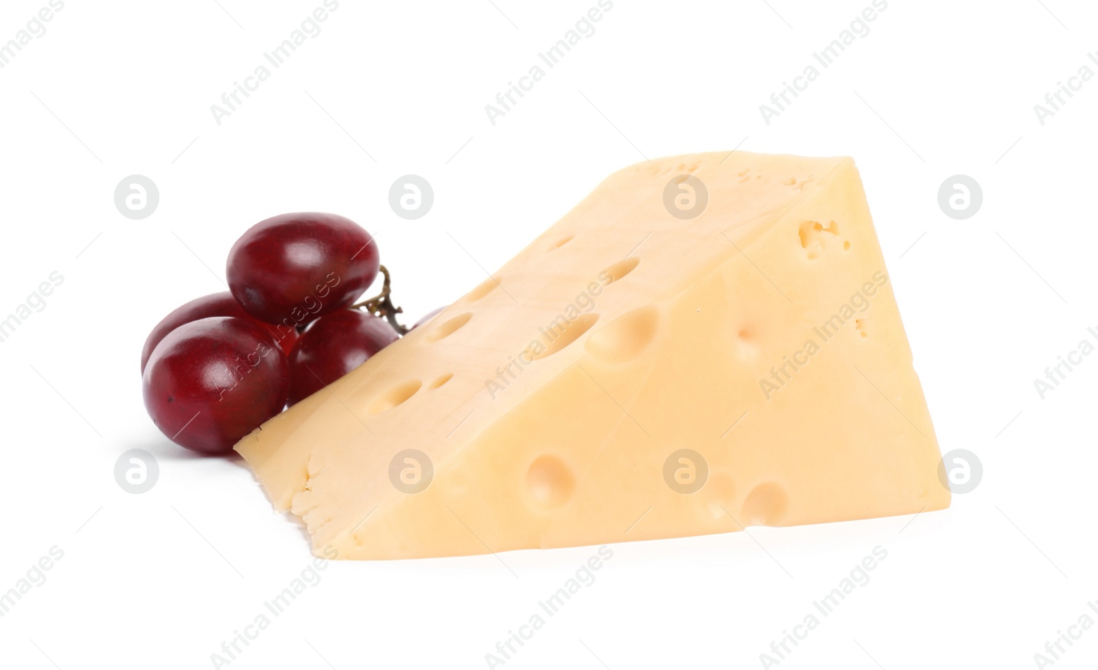 Photo of Piece of delicious cheese and grapes isolated on white