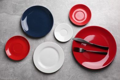 Flat lay composition with beautiful dishware on grey table