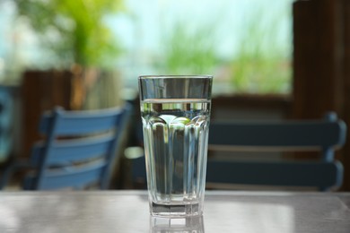 Photo of Glass of fresh water on table indoors