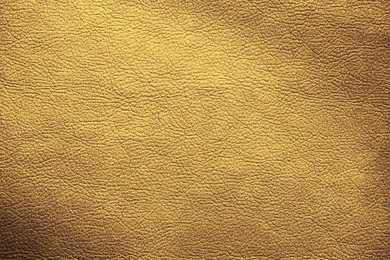 Image of Golden textured surface as background, closeup view