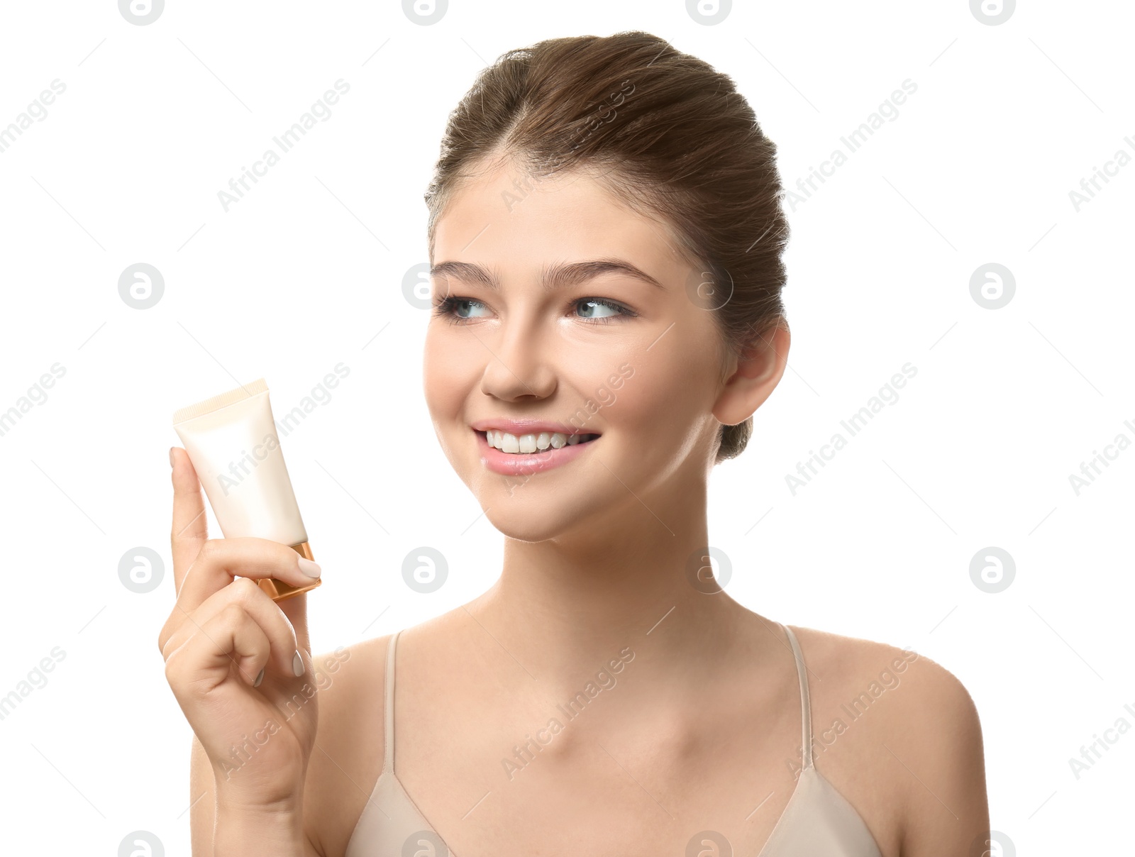 Photo of Beautiful girl with tube of foundation on white background