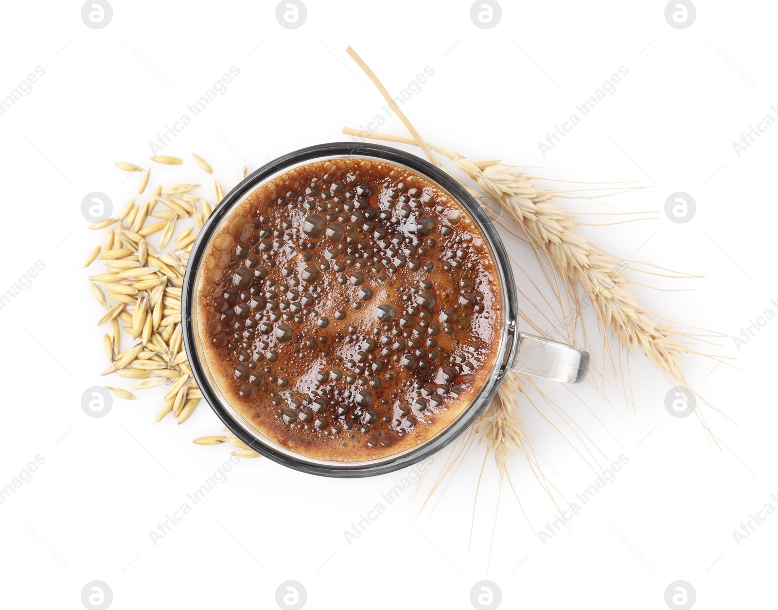 Photo of Cup of barley coffee, grains and spikes isolated on white, top view