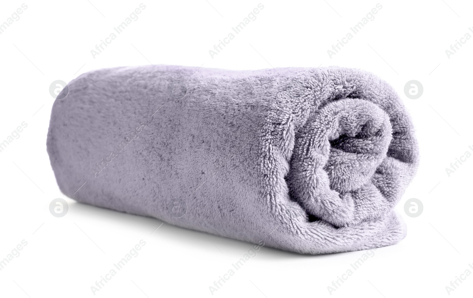 Photo of Rolled soft terry towel on white background