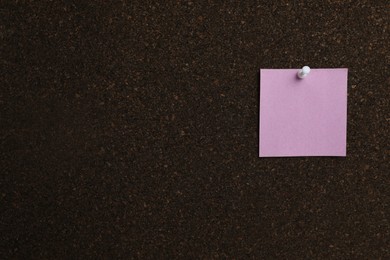 Photo of Violet paper note pinned to cork board. Space for text