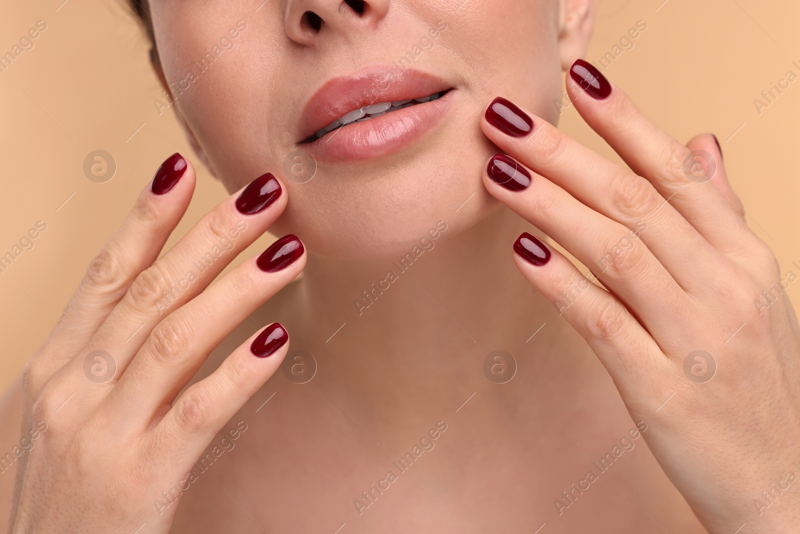 Photo of Woman with beautiful lips on beige background, closeup