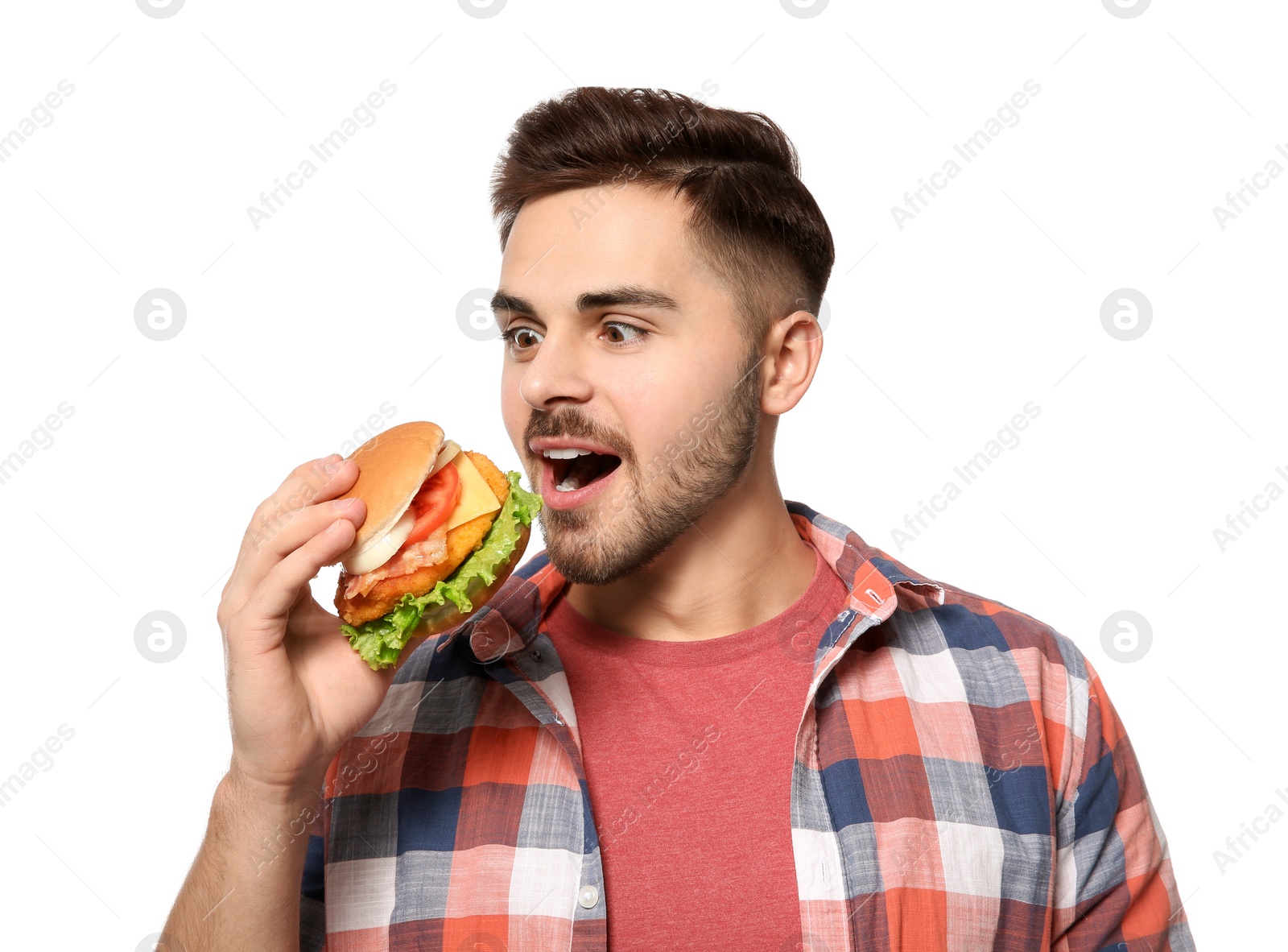 Photo of Handsome man eating tasty burger isolated on white