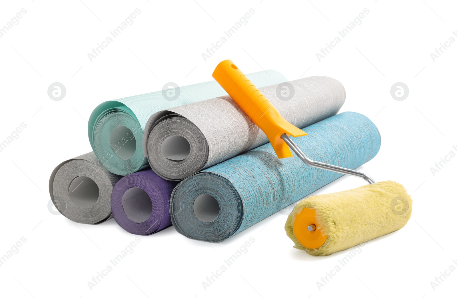 Photo of Different wallpaper rolls and roller isolated on white