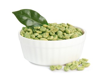 Photo of Bowl with green coffee beans and fresh leaf on white background