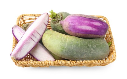 Photo of Purple and green daikon radishes in wicker basket isolated on white