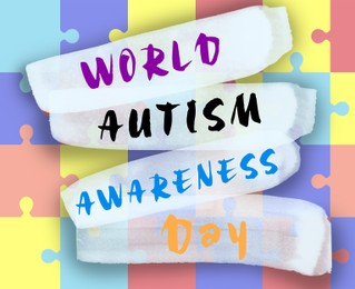 Illustration of Many colorful puzzle pieces and text World Autism Awareness Day, top view
