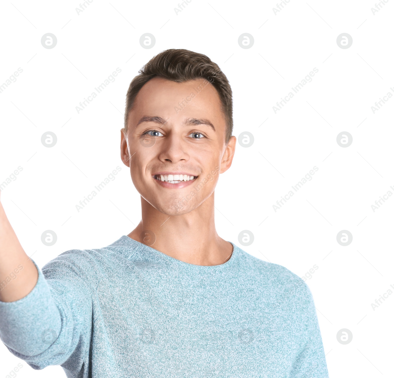 Photo of Laughing man taking selfie on white background