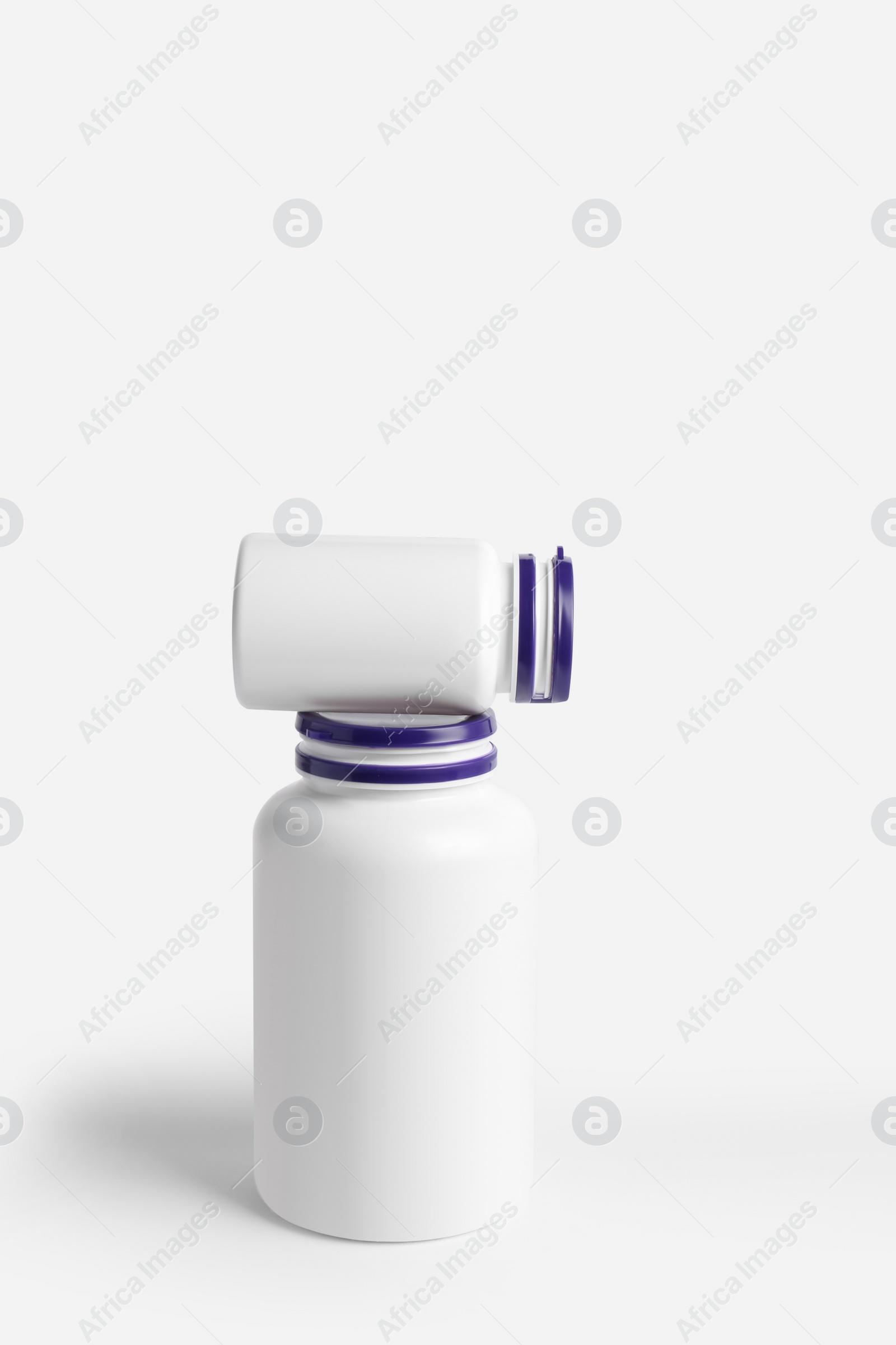 Photo of Closed plastic medicine bottles on white background. Medicament