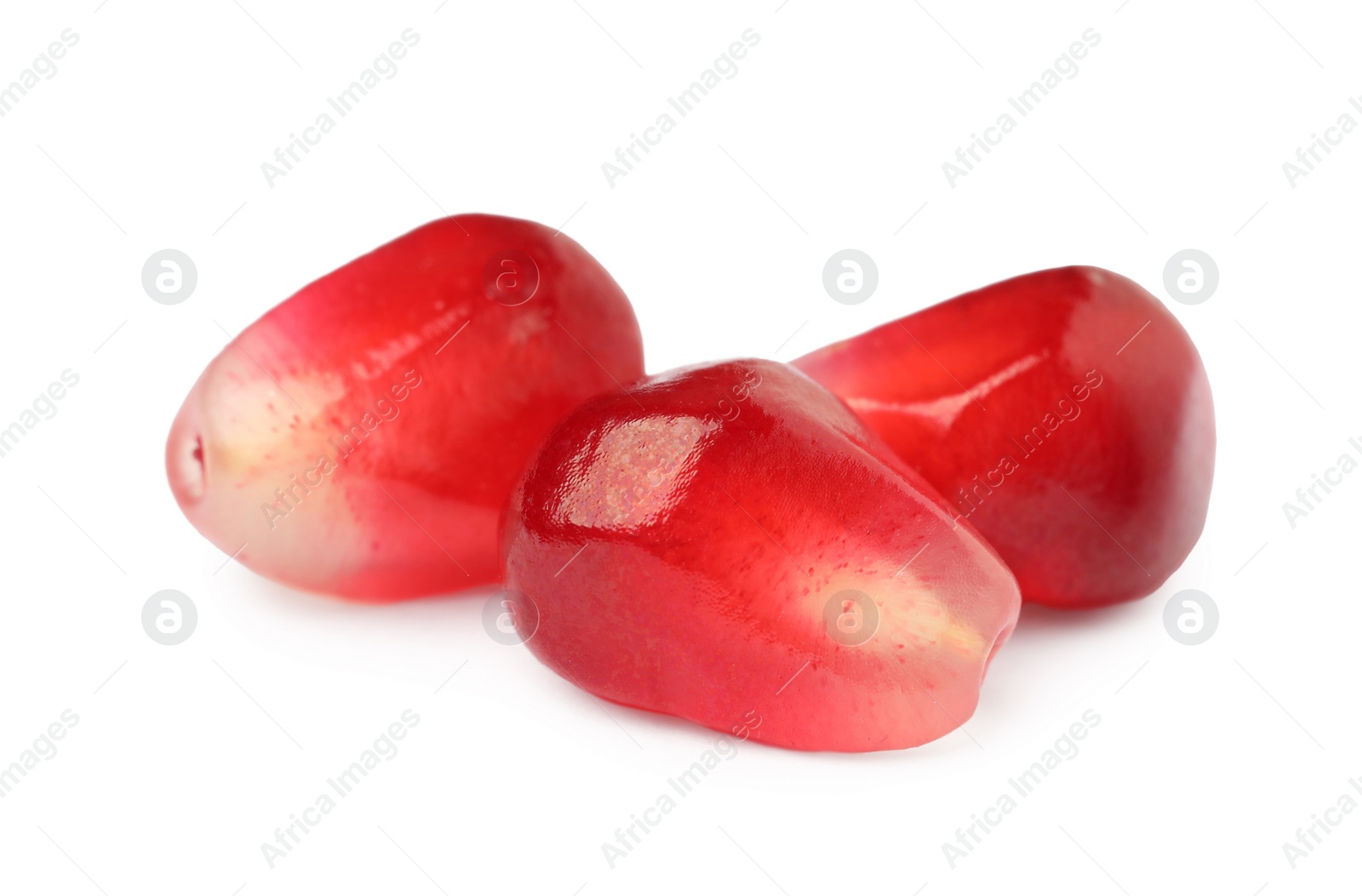 Photo of Juicy red pomegranate seeds on white background