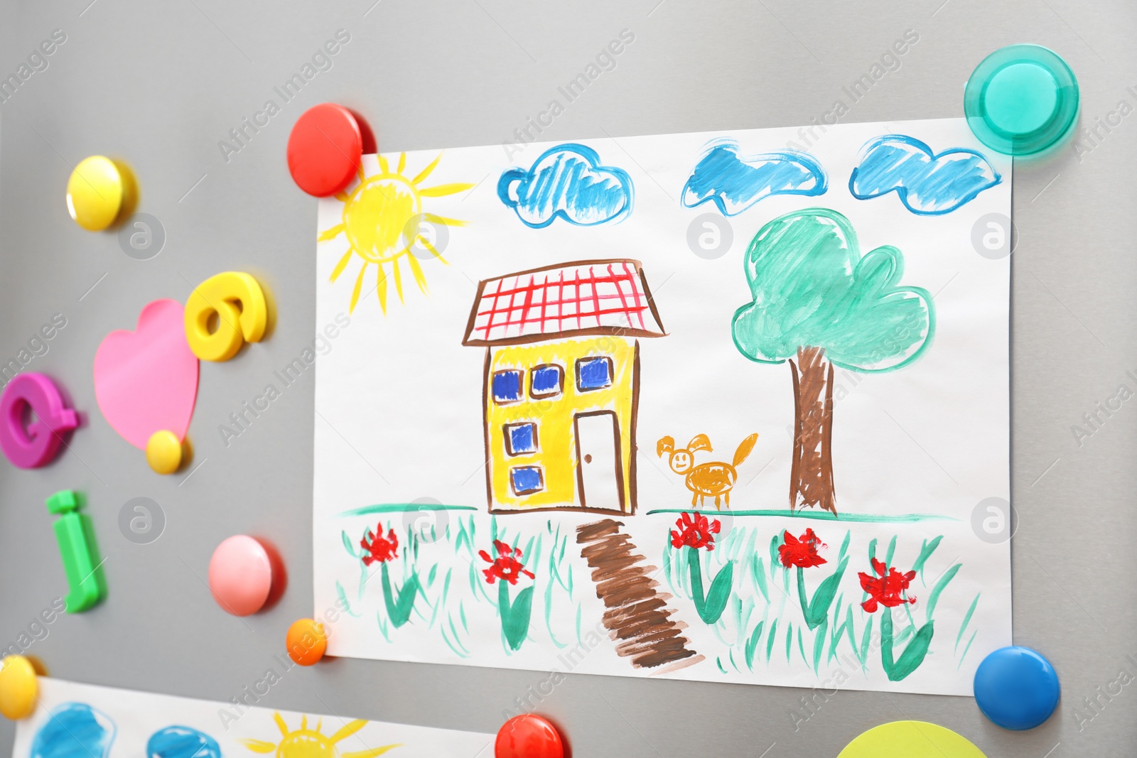 Photo of Child's drawing and magnets on refrigerator door as background