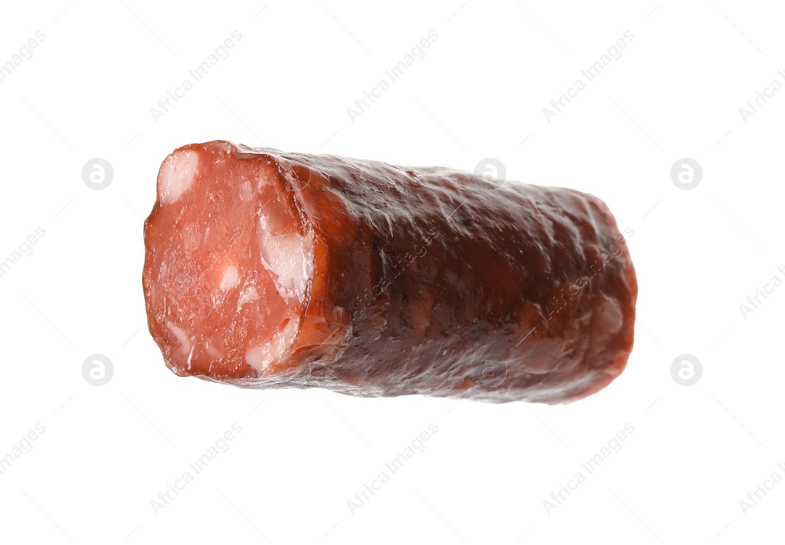 Photo of Piece of thin dry smoked sausage isolated on white