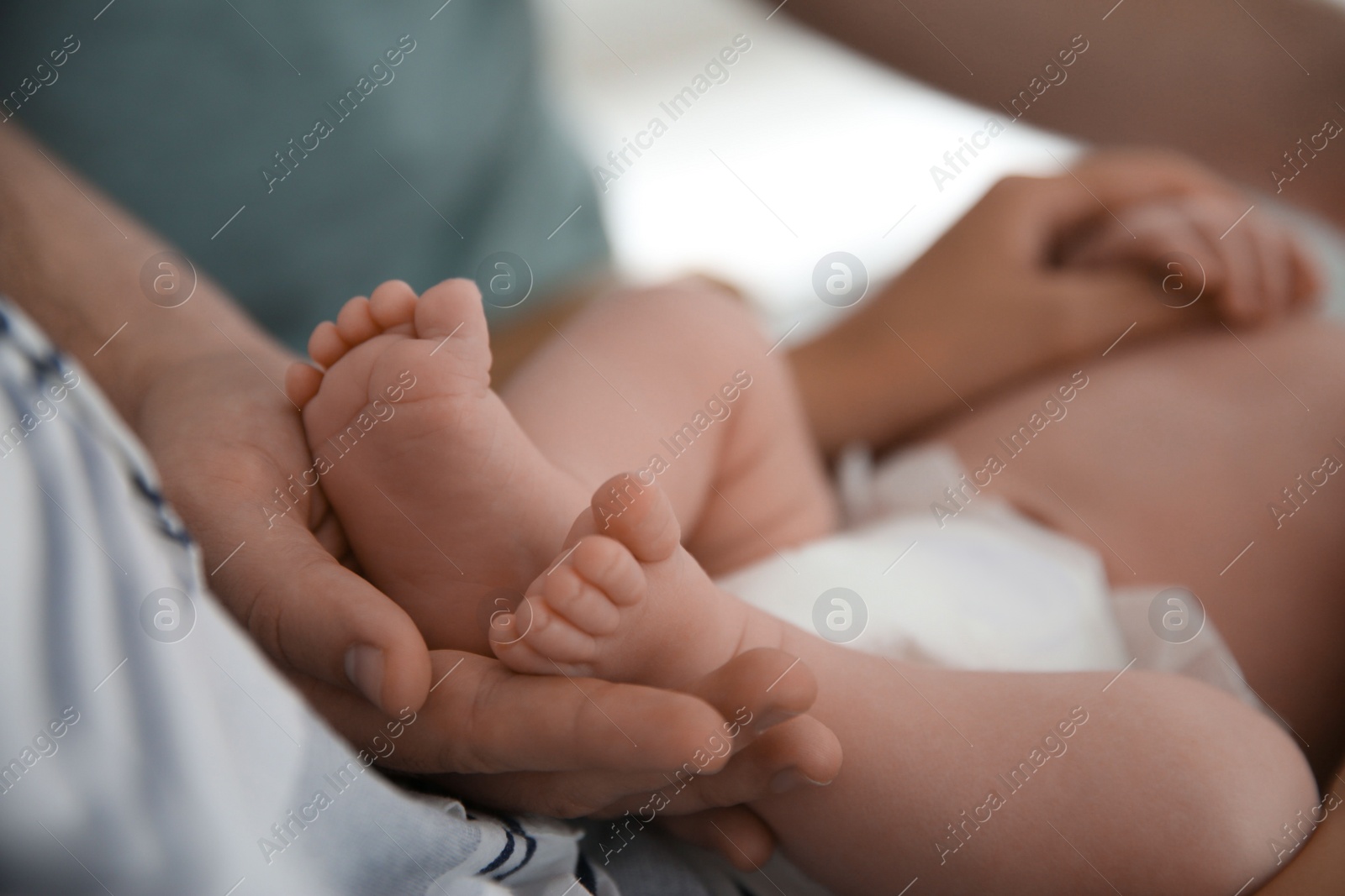 Photo of Couple with their newborn baby, closeup view