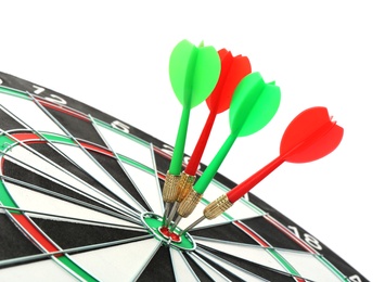 Photo of Dart board with color arrows hitting target, closeup