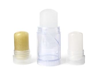Photo of Natural crystal alum stick deodorants on white background