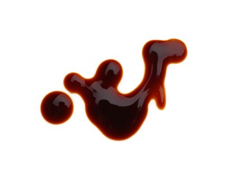 Photo of Spilled soy sauce on white background, top view