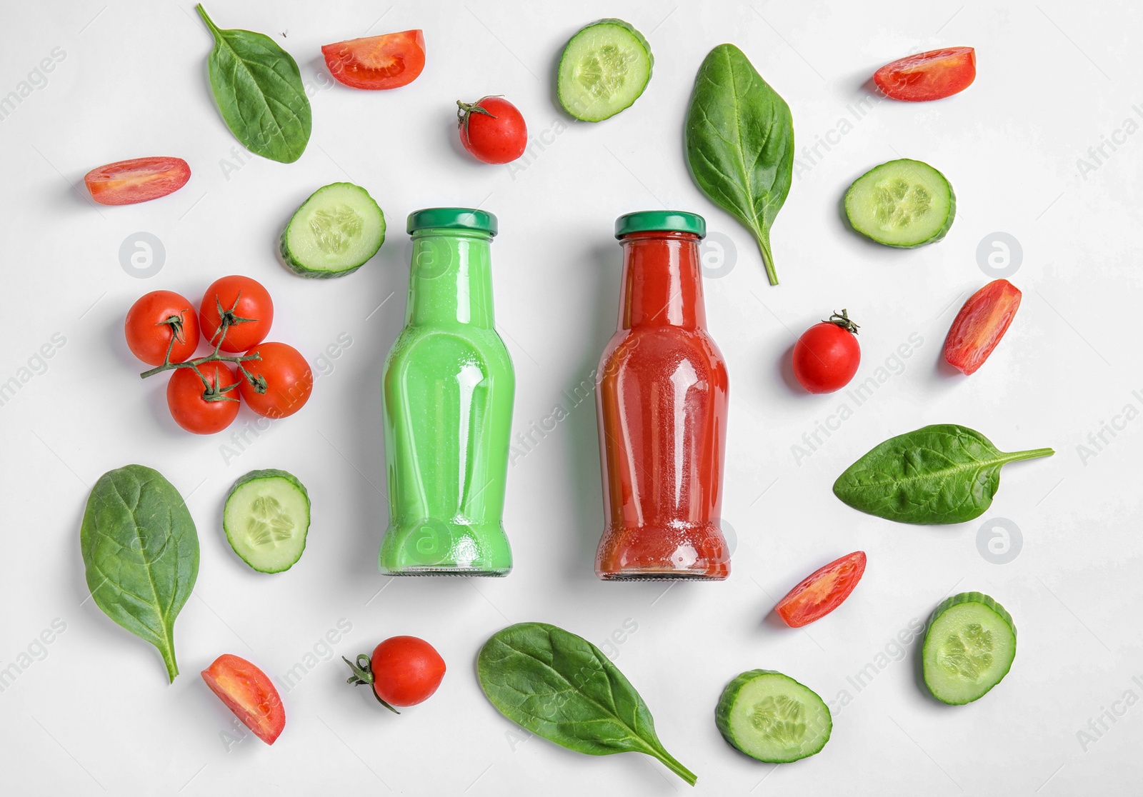 Photo of Flat lay composition with bottles of juices on white background