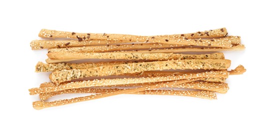 Fresh delicious grissini sticks on white background, top view