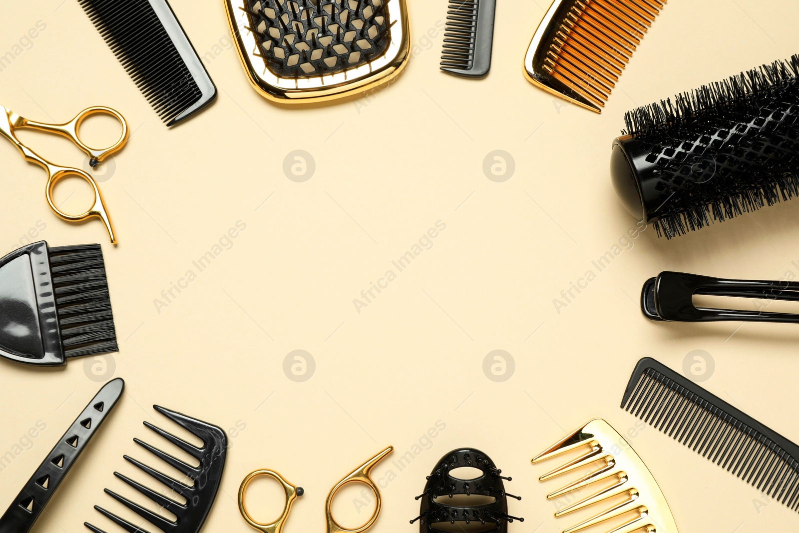 Photo of Frame of hairdressing tools on beige background, flat lay. Space for text