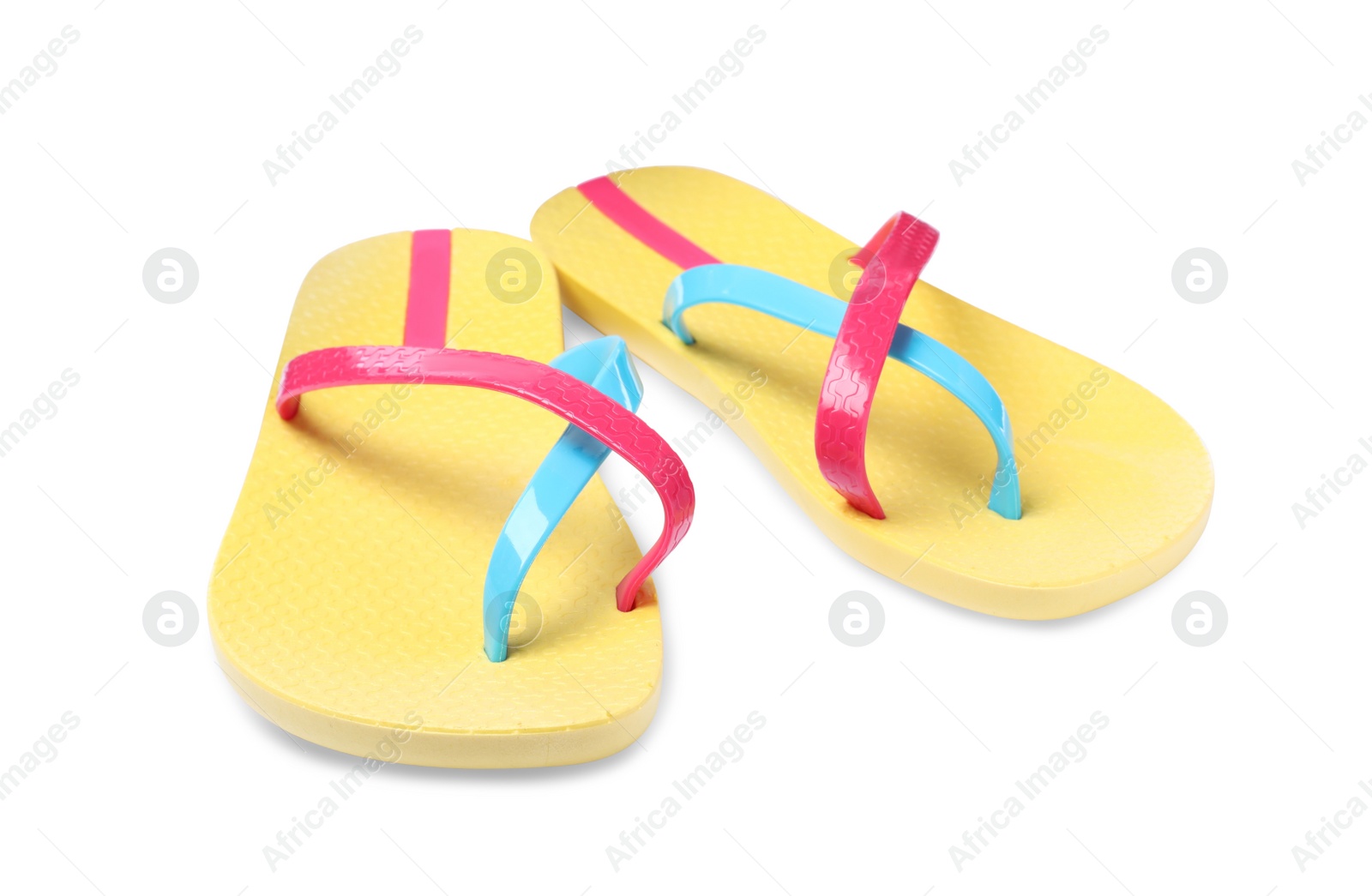 Photo of Pair of yellow flip flops isolated on white