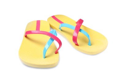 Photo of Pair of yellow flip flops isolated on white