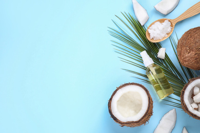 Photo of Flat lay composition with coconut oil on light blue background, space for text