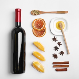 Photo of Composition with ingredients for mulled wine on white background, top view. Space for text